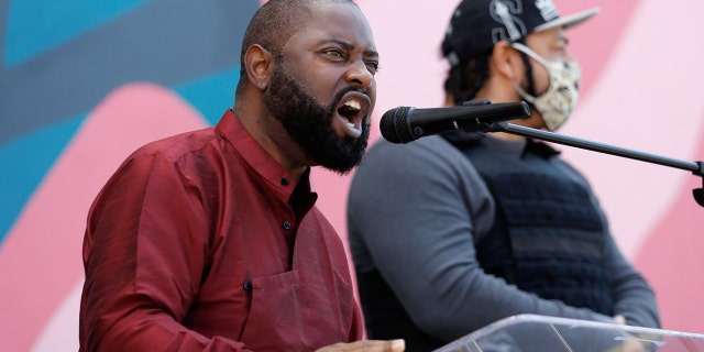 Community activist Andre Taylor, whose brother Che Taylor was fatally shot by police in 2016, speaks to the crowd during a community gathering remembering George Floyd, Breonna Taylor and Ahmaud Arbery at First African Methodist Episcopal Church in Seattle, Washington, U.S. June 1, 2020. REUTERS/Lindsey Wasson