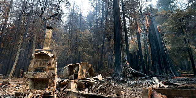 The fireplace of the Nature Lodge Museum and Store at Big Basin Redwoods State Park stands among the devastation Friday, Aug. 28, 2020, in Boulder Creek, Calif., wrought by the CZU August Lightning Complex, which destroyed nearly all buildings and burned thousands of trees at the park.