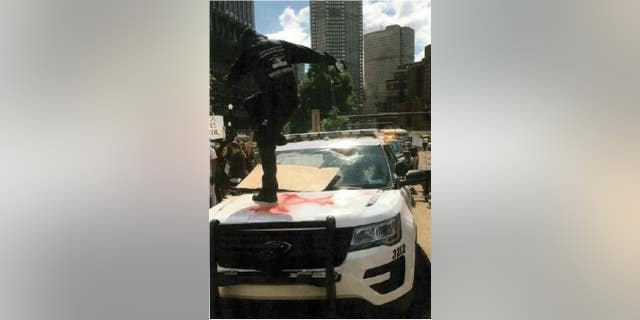 Bartels on Pittsburgh Police car.