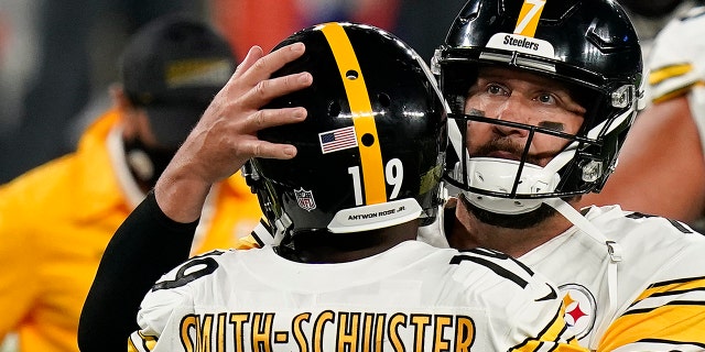 Pittsburgh Steelers wide receiver JuJu Smith-Schuster (19) celebrates with Pittsburgh Steelers quarterback Ben Roethlisberger (7) after scoring a touchdown against the New York Giants during the fourth quarter of an NFL football game Monday, Sept. 14, 2020, in East Rutherford, N.J. (AP Photo/Seth Wenig, File)