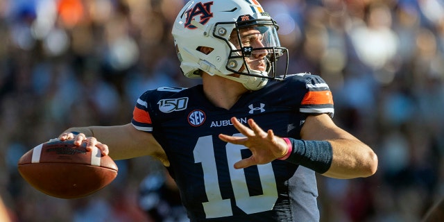 In this Saturday, Nov. 30, 3019, file photo, Auburn quarterback Bo Nix throws against Alabama during the first half of an NCAA college football game, in Auburn, Ala. (AP Photo/Vasha Hunt, File)