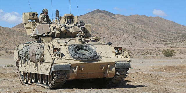 U.S. Army Soldiers from Bravo Company, 1st Battalion, 8th Cavalry Regiment, 2nd Brigade Combat Team, 1st Cavalry Division, provide security around a local town during Decisive Action Rotation 15-05 at the National Training Center in Fort Irwin, Calif., March 3, 2015. Decisive Action Rotations are geared toward an adaptive enemy in a complex environment. 