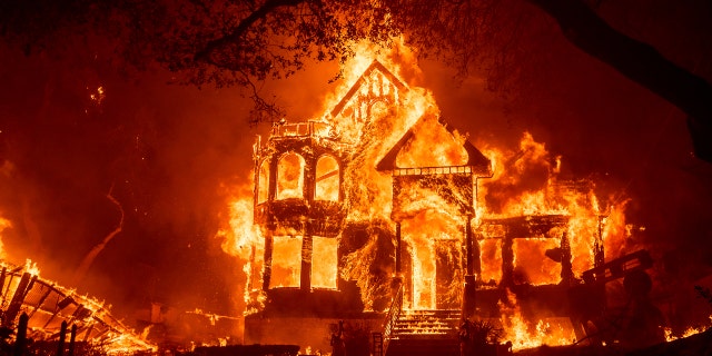 Flames from the Glass Fire consume the Glass Mountain Inn late Sunday, Sept. 27, 2020, in St. Helena, Calif.