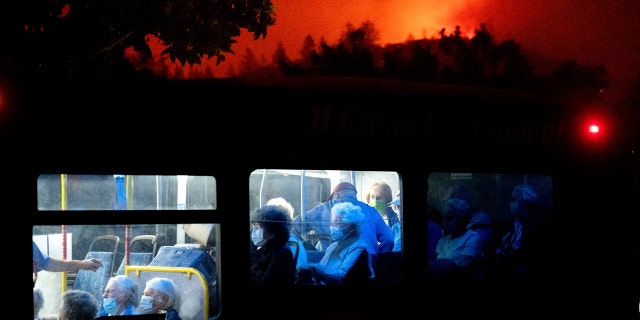 Residents of the Oakmont Gardens senior home evacuate on a bus as the Shady Fire approaches in Santa Rosa, Calif., Monday, Sept. 28, 2020.
