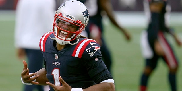 New England Patriots quarterback Cam Newton celebrates after defeating the Las Vegas Raiders in an NFL football game, Sunday, Sept. 27, 2020, in Foxborough, Mass. (AP Photo/Charles Krupa)