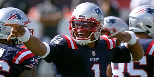 New England Patriots quarterback Cam Newton signals a first down in the second half of an NFL football game against the Miami Dolphins, Sunday, Sept. 13, 2020, in Foxborough, Mass. (AP Photo/Steven Senne)