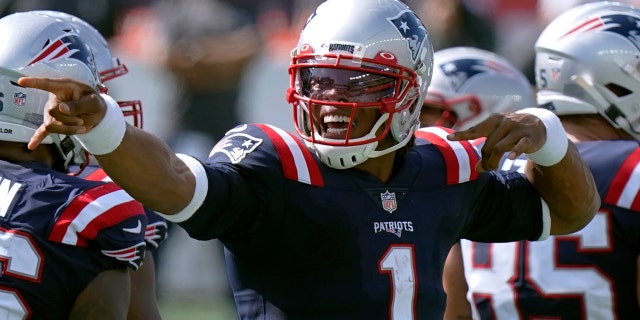 New England Patriots quarterback Cam Newton signals a first down in the second half of an NFL football game against the Miami Dolphins, Sunday, Sept. 13, 2020, in Foxborough, Mass. (AP Photo/Steven Senne)
