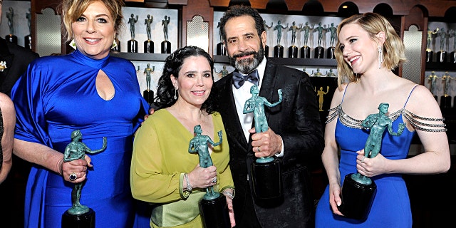 Caroline Aaron, Alex Borstein, Rachel Brosnahan, and Tony Shalhoub, winners of Outstanding Performance by an Ensemble in a Comedy Series for 'The Marvelous Mrs. Maisel', pose in the trophy room during the 26th Annual Screen Actors Guild Awards at The Shrine Auditorium on January 19, 2020, in Los Angeles, California.