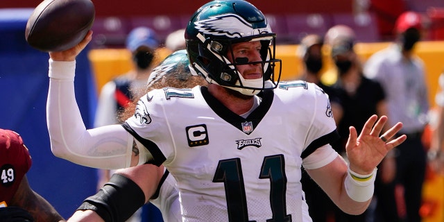 Philadelphia Eagles quarterback Carson Wentz looks to pass the ball against the Washington Football Team during the first half of an NFL football game, Sunday, Sept. 13, 2020, in Landover, Md. (AP Photo/Susan Walsh)