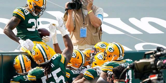 Green Bay Packers' Chandon Sullivan celebrates his interception returned for a touchdown during the second half of an NFL football game against the Detroit Lions Sunday, Sept. 20, 2020, in Green Bay, Wis. (AP Photo/Morry Gash)