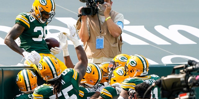 Green Bay Packers' Chandon Sullivan celebrates his interception returned for a touchdown during the second half of an NFL football game against the Detroit Lions Sunday, Sept. 20, 2020, in Green Bay, Wis. (AP Photo/Morry Gash)