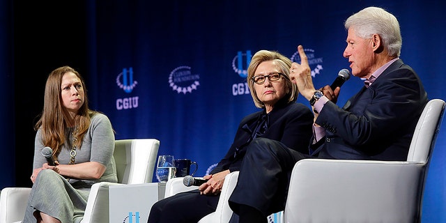 Chelsea Clinton, left, former Secretary of State Hillary Clinton and former President Bill Clinton attend a CGI event on climate change at the University of Chicago in 2018.