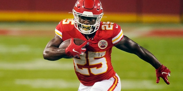 Kansas City Chiefs running back Clyde Edwards-Helaire carries the ball against the Houston Texans in the first half of an NFL football game Thursday, Sept. 10, 2020, in Kansas City, Mo. (AP Photo/Charlie Riedel)