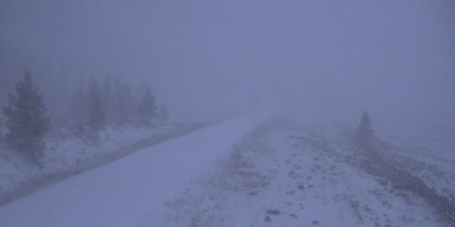 Snow was falling Tuesday morning in northern Colorado as a storm system moved into the area.