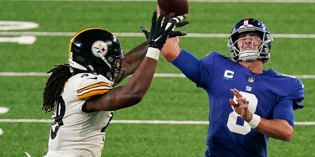 New York Giants quarterback Daniel Jones (8) throws under pressure from Pittsburgh Steelers outside linebacker Bud Dupree (48) during the third quarter of an NFL football game Monday, Sept. 14, 2020, in East Rutherford, N.J. (AP Photo/Seth Wenig)