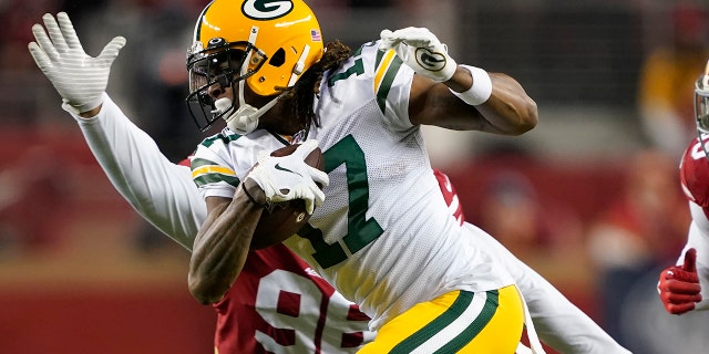 Green Bay Packers wide receiver Davante Adams (17) runs in front of San Francisco 49ers defensive tackle Sheldon Day during the second half of the NFL NFC Championship football game in Santa Clara, Calif. (AP Photo/Tony Avelar, File)
