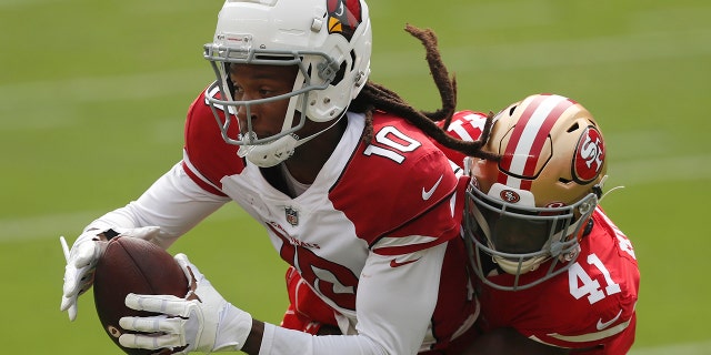 Arizona Cardinals wide receiver DeAndre Hopkins (10) catches a pass against San Francisco 49ers cornerback Emmanuel Moseley (41) during the first half of an NFL football game in Santa Clara, Calif., Sunday, Sept. 13, 2020. (AP Photo/Josie Lepe)