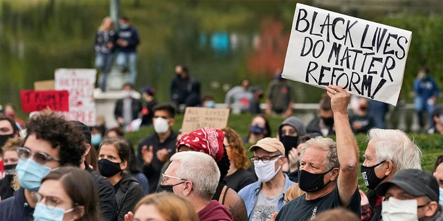 Protesters attend a rally near the debate hall, Tuesday, Sept. 29, 2020, in Cleveland. The first presidential debate between Republican candidate President Donald Trump and Democratic candidate and former Vice President Joe Biden is being held in Cleveland Tuesday. (AP Photo/Tony Dejak)