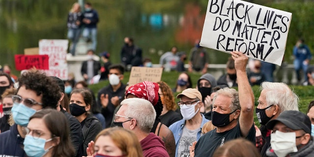 Protesters attend a rally near the debate hall, Tuesday, Sept. 29, 2020, in Cleveland. The first presidential debate between Republican candidate President Donald Trump and Democratic candidate and former Vice President Joe Biden is being held in Cleveland Tuesday. (AP Photo/Tony Dejak)