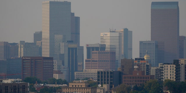 Smoke from several wildfires envelops the Denver skyline on Saturday, Sept. 26, 2020.