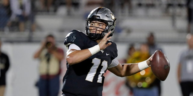 Central Florida quarterback Dillon Gabriel looks for a receiver during the second half of an NCAA college football game against East Carolina, Saturday, Oct. 19, 2019, in Orlando, Fla. Gabriel and the 13th-ranked Knights open American Athletic Conference play on the road Saturday at East Carolina. (AP Photo/John Raoux)