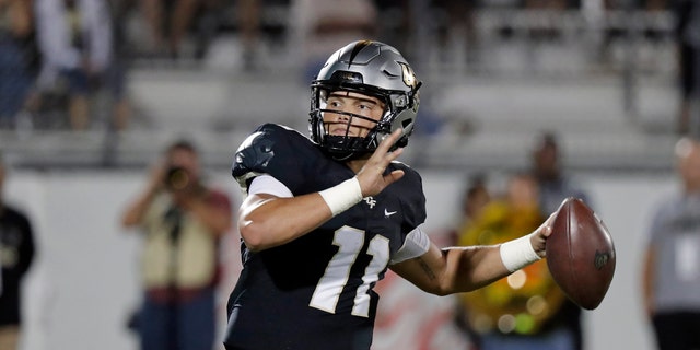 Central Florida quarterback Dillon Gabriel looks for a receiver during the second half of an NCAA college football game against East Carolina, Saturday, Oct. 19, 2019, in Orlando, Fla. Gabriel and the 13th-ranked Knights open American Athletic Conference play on the road Saturday at East Carolina. (AP Photo/John Raoux)