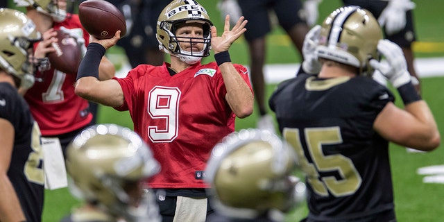 New Orleans Saints quarterback Drew Brees (9) throws the ball during training camp Aug. 29, 2020, in New Orleans.