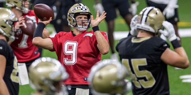 New Orleans Saints quarterback Drew Brees (9) throws the ball during training camp Aug. 29, 2020, in New Orleans.