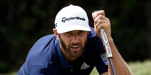 Dustin Johnson lines his putt on the first green during the final round of the BMW Championship golf tournament at the Olympia Fields Country Club in Olympia Fields, Ill., Aug. 30, 2020. (Associated Press)