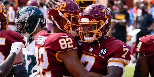 Washington Football Team tight end Logan Thomas (82) celebrates his touchdown against Philadelphia Eagles with teammate quarterback Dwayne Haskins (7), during the first half of an NFL football game, Sunday, Sept. 13, 2020, in Landover, Md. (AP Photo/Susan Walsh)