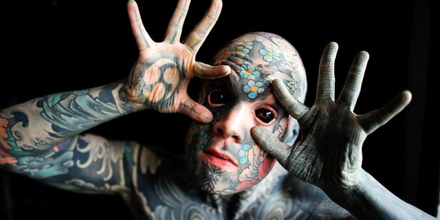 France's "most tattooed man"poses with his eyes full of black ink at Palaiseau, southern Paris, France on Sep. 25, 2020. (Reuters/Charles Platiau)
