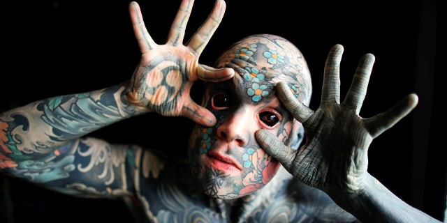 France's "most tattooed man"poses with his eyes full of black ink at Palaiseau, southern Paris, France on Sep. 25, 2020. (Reuters/Charles Platiau)