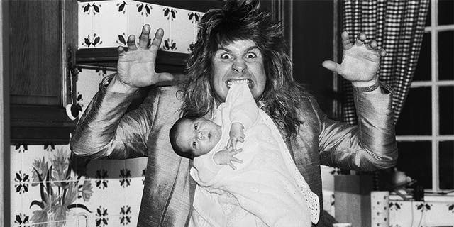 Ozzy Osbourne, former lead singer of Black Sabbath, pictured at home two weeks after the birth of his baby boy Jack on November 25, 1985.