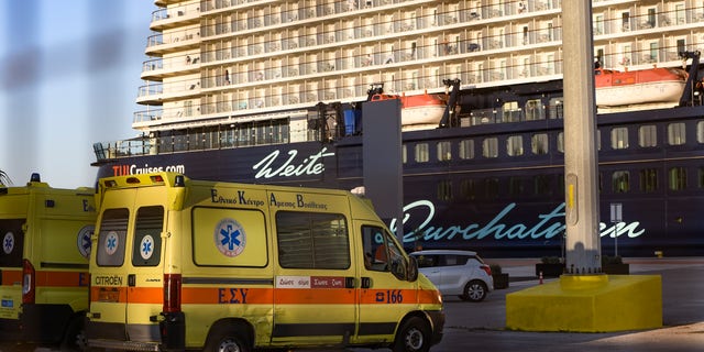 Ambulance waiting outside the Mein Schiff 6 cruise ship as is docked at Piraeus port on Sept. 29. (Dimitris Lampropoulos/NurPhoto via Getty Images)