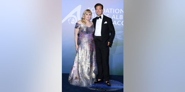 Rebel Wilson and Jacob Busch pose for a photo together at the Monte-Carlo Gala For Planetary Health on September 24, 2020, in Monte-Carlo, Monaco