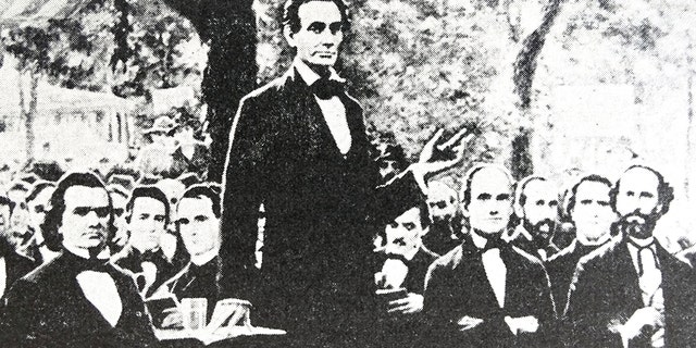 Abraham Lincoln issued the Emancipation Proclamation on January 1, 1863. He is seen here standing in one of a series of seven debates regarding slavery with Stephen Douglas (at Lincoln's right), his rival for a seat in the Senate. These debates permitted both candidates to discuss their views on slavery. (Photo by: Universal History Archive/UIG via Getty images)