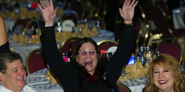 Black Sabbath lead singer and MTV star British Ozzy Osbourne (C) parties at the 2002 annual White House Correspondents Dinner on May 4, 2002, in Washington, DC. US actor/comedian Drew Carey is the featured entertainment for the dinner with attracts leading political figures and Hollywood stars.