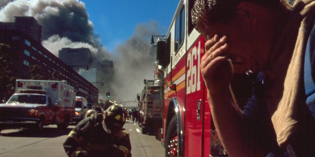 Colour photograph of a New York Fire-fighter amid the rubble of the World Trade Centre following the 9/11 attacks. Dated 2001. (Universal History Archive/Universal Images Group via Getty Images)