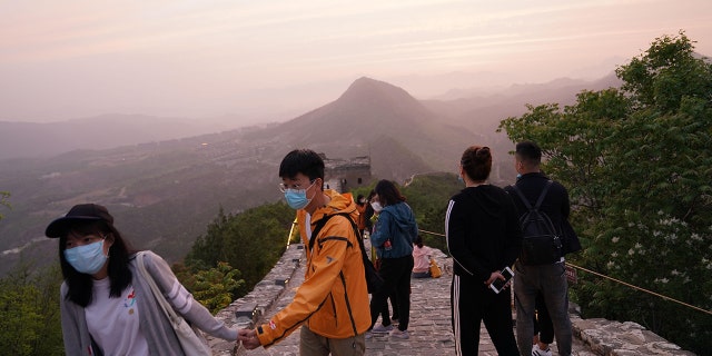 Anyone caught violating the mandates, and observed climbing the off-limits sections of the wall, will be sibject to fines. (Su Dan/China News Service via Getty Images)