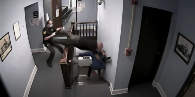 Highland County Sheriff’s Deputy Ben Reno is captured on surveillance video leaping over a stair railing.