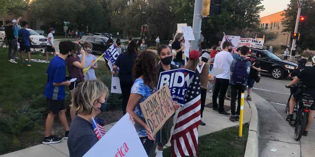 A group of anti-Trump protests gathered across the street from a pro-Trump demonstration on Sept. 25 in Northbrook, Ill.