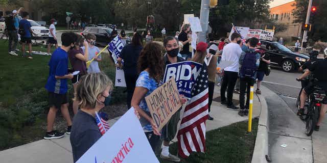 A group of anti-Trump protests gathered across the street from a pro-Trump demonstration on Sept. 25 in Northbrook, Ill.