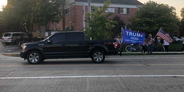 Several vehicles honked in support of President Trump during a demonstration on Sept. 25 in Northbrook, Ill.