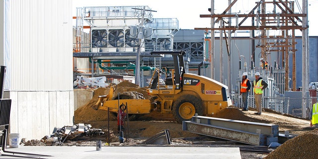 The Iowa Premium Beef plant in Tama, Iowa, seen here construction in 2014, had temporarily closed earlier this year after hundreds of its workers tested positive for COVID-19. (Matthew Putney/The Courier via AP, File)