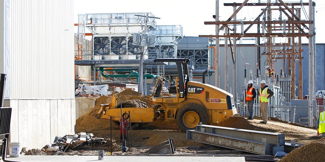 The Iowa Premium Beef plant in Tama, Iowa, seen here construction in 2014, had temporarily closed earlier this year after hundreds of its workers tested positive for COVID-19. (Matthew Putney/The Courier via AP, File)
