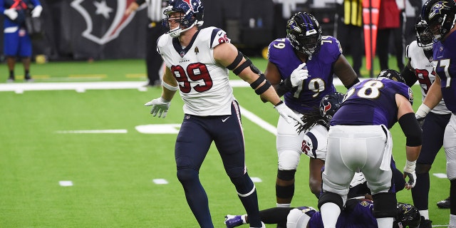 Houston Texans defensive end J.J. Watt (99) celebrates after sacking Baltimore Ravens quarterback Lamar Jackson during the first half of an NFL football game Sunday, Sept. 20, 2020, in Houston. (AP Photo/Eric Christian Smith)