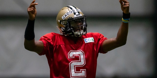 Wearing the name of Jacob Blake on his helmet, New Orleans Saints quarterback Jameis Winston (2) dances during an NFL football training camp practice inside the Ochsner Sports Performance Center in Metairie, La., Thursday, Aug. 27, 2020. (David Grunfeld/The Advocate via AP, Pool)