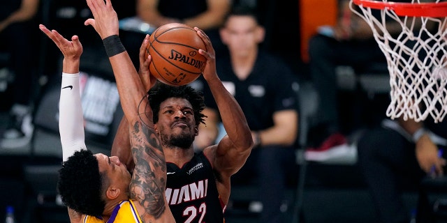 Miami Heat's Jimmy Butler twisted his ankle in the game. (AP Photo/Mark J. Terrill)