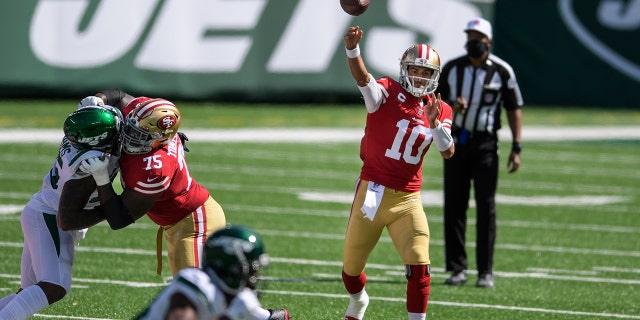 San Francisco 49ers quarterback Jimmy Garoppolo (10) throws a pass during the first half of an NFL football game against the New York Jets, Sunday, Sept. 20, 2020, in East Rutherford, N.J. (AP Photo/Bill Kostroun)