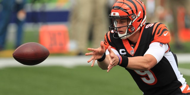 Cincinnati Bengals quarterback Joe Burrow (9) tosses the football during the first half of an NFL football game against the Los Angeles Chargers, Sunday, Sept. 13, 2020, in Cincinnati. (AP Photo/Aaron Doster)